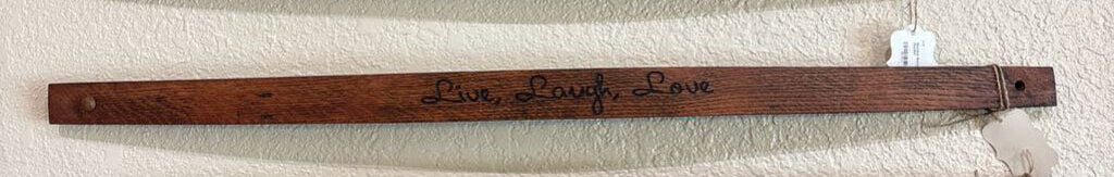 Wooden barrel staves with text on a wall
